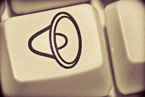 Computer key with speaker sign Stock Photos