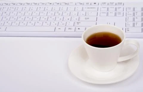 Computer keyboard and coffee Foto stock