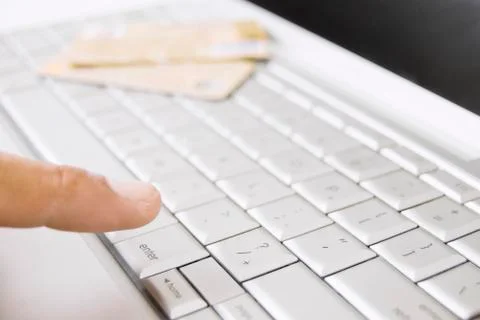 Computer keyboard and finger Stock Photos