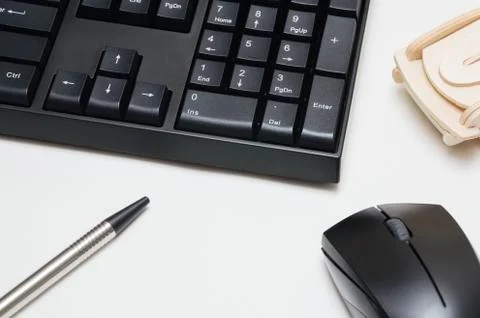 Computer keyboard and mouse, pen, wooden car isolated on white background Stock Photos