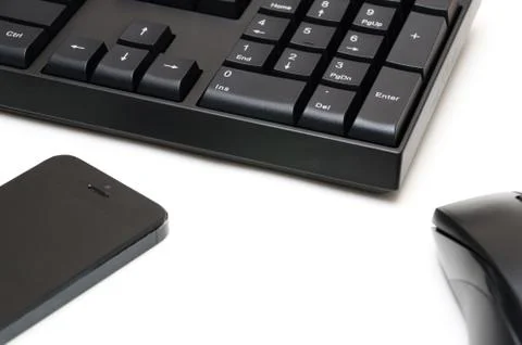Computer keyboard and mouse, phone isolated on white background Stock Photos