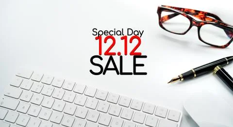 Computer Keyboard and Mouse with Various Office Supplies on white Desk with C Stock Photos