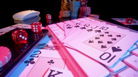 Computer keyboard and Royal Street Flush on black background. Cards, casino Stock Footage 187503328