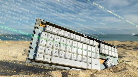 Computer keyboard on a beach 写真素材