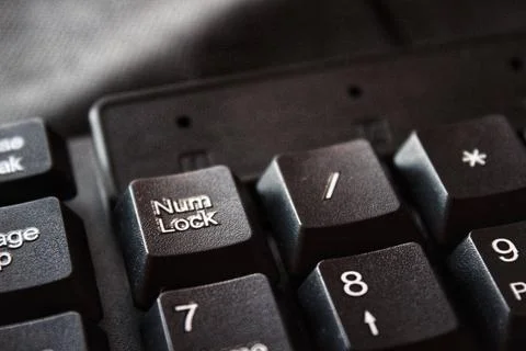 Computer keyboard on black background Photos