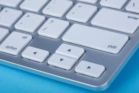 Computer keyboard on blue background Stock Photos