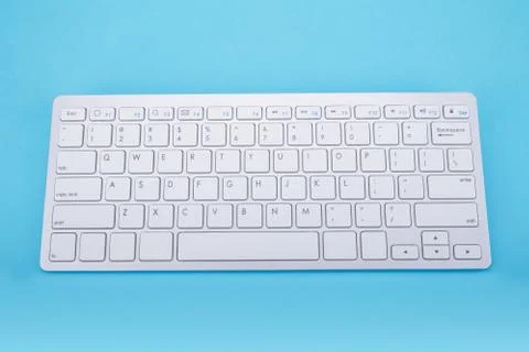 Computer keyboard on blue background Stock Photos
