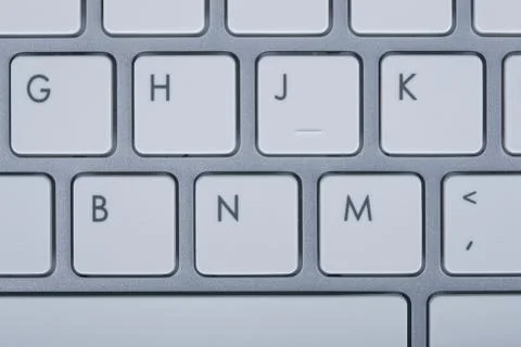 Computer keyboard on blue background Stock Photos