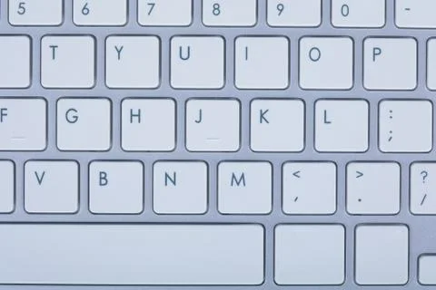 Computer keyboard on blue background 스톡 사진