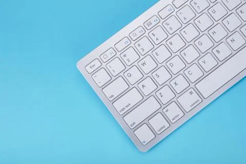 Computer keyboard on blue background 스톡 사진