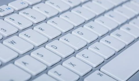 Computer keyboard on blue background Stock Photos