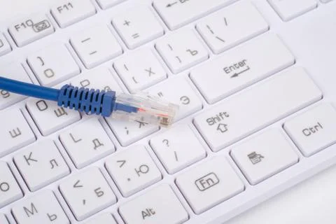 Computer keyboard with blue cable Stock Photos
