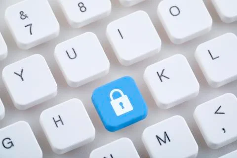 Computer keyboard with blue lock button. Computer security concept. Foto stock