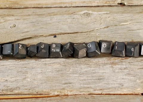 Computer keyboard buttons on old wood background, Stock Photos