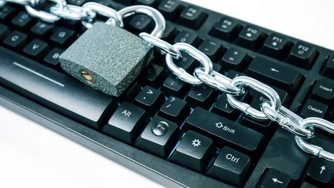 Computer keyboard chained, cybersecurity metaphor 4k Stock Footage 82648929
