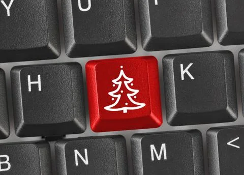 Computer keyboard with Christmas tree key Stock Photos