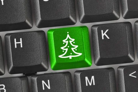 Computer keyboard with Christmas tree key Stock Photos