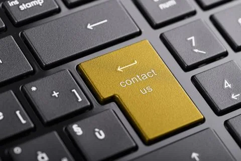 Computer keyboard with "contact us" button, selected focus on enter button Stock Photos