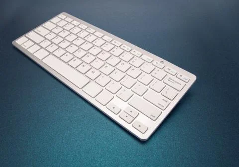 Computer keyboard on dark blue background Stock Photos