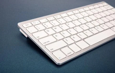 Computer keyboard on dark blue background 스톡 사진