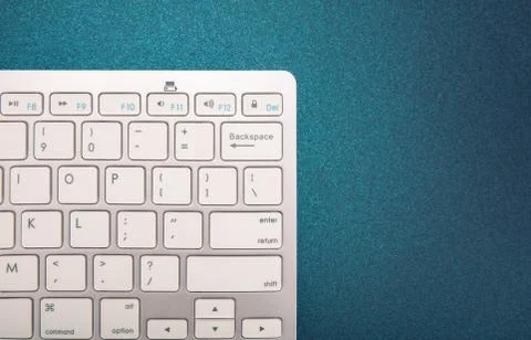 Computer keyboard on dark blue background Stock Photos