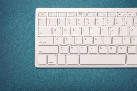 Computer keyboard on dark blue background Stock Photos