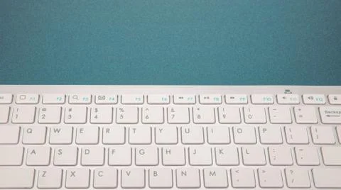 Computer keyboard on dark blue background 스톡 사진