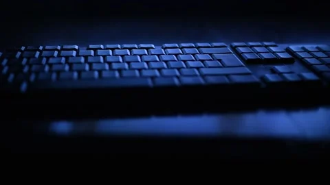 A computer keyboard in the dark night in blue LIGHT Stock Footage 142163268