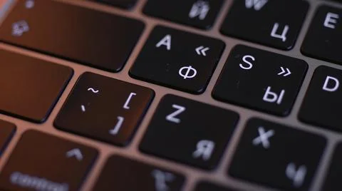 Computer keyboard details background. Action. Close up top view of white letters Foto stock