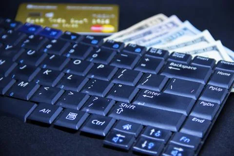 Computer keyboard with dollars and card Stock Photos