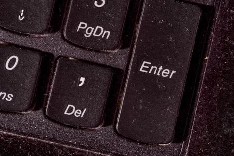 A computer keyboard. Focus on enter button. Black background Stock Photos