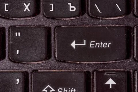 A computer keyboard. Focus on enter button. Black background Stock Photos