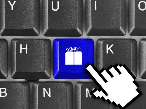 Computer keyboard with gift key Computer keyboard with gift key - business... Stock-Fotos