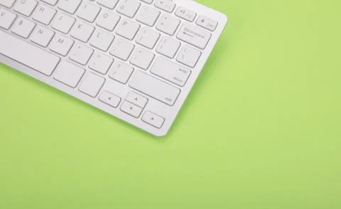 Computer keyboard on green background Stock Photos