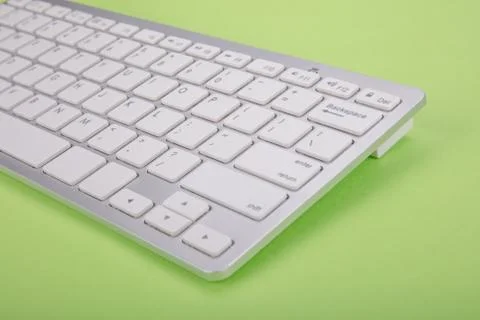 Computer keyboard on green background Stock Photos