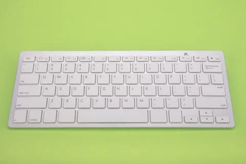 Computer keyboard on green background Stock Photos
