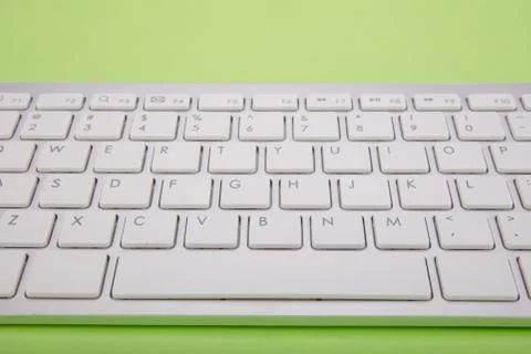 Computer keyboard on green background Stock Photos