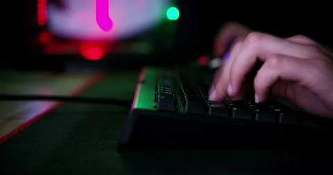 Computer keyboard, hands or person typing, gaming or play online, fantasy RPG or Video stock 254264167