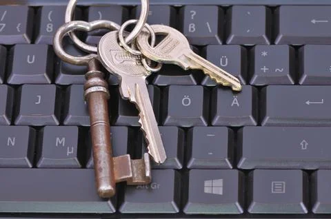 Computer keyboard with a key ring.Computer keyboard with a key ring Stock Photos