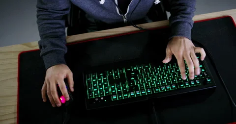 Computer, keyboard light and gaming man, nerd or video game tester check virtual Video stock 254106335