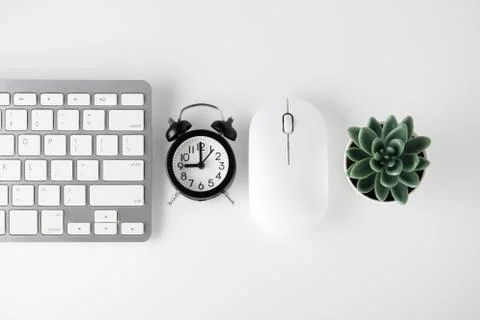 Computer keyboard, mouse and clock on white desk, online sale, cyber monday,  Stock Photos
