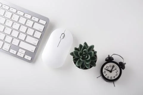 Computer keyboard, mouse, clock on white desk, online sale, cyber monday, fla Stock Photos