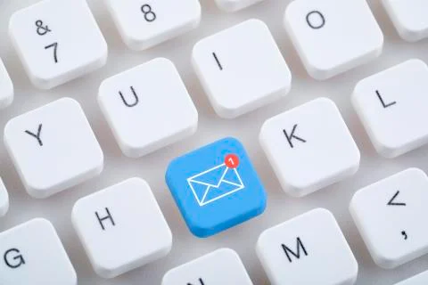 Computer keyboard with new email button. Stock Photos