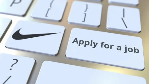 Computer keyboard with NIKE logo and Apply for a job text on the keys. Editorial Stock Footage 103862553