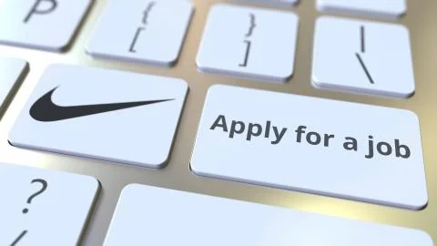 Computer keyboard with NIKE logo and Apply for a job text on the keys. Editorial 库存插图