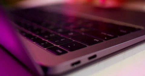 Computer keyboard, notebuc filmed almost in focus. Using, browsing the internet. Stock Footage 147591072