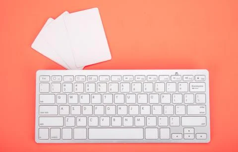 Computer keyboard on orange background 스톡 사진