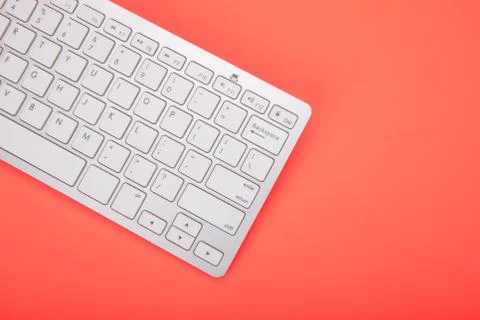 Computer keyboard on orange background 스톡 사진