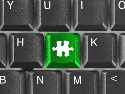 Computer keyboard with puzzle key Stock Photos
