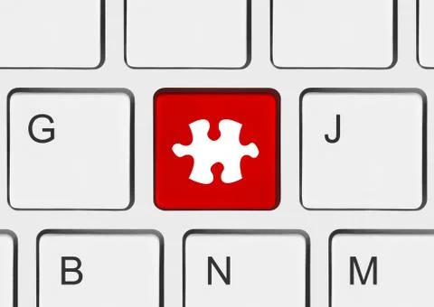 Computer keyboard with puzzle key Stock Photos